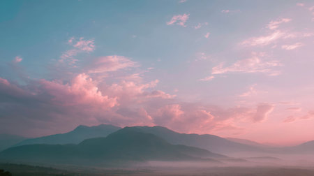 This breathtaking landscape showcases majestic mountains under a colorful sky at dusk. The soft pastel hues create a tranquil atmosphere, ideal for nature photography.の素材