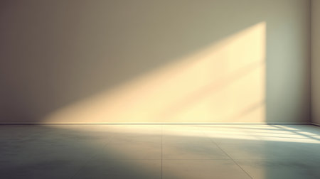 A minimalist empty room showcasing soft morning light and gentle shadows, creating a serene ambiance and perfect backdrop for interior design projects.の素材
