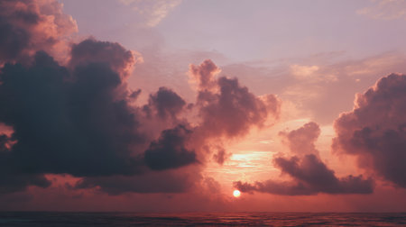 Experience the beauty of a captivating sunset over the ocean. Vibrant colors paint the sky as clouds drift above reflecting the serene landscape. Perfect for relaxation.の素材