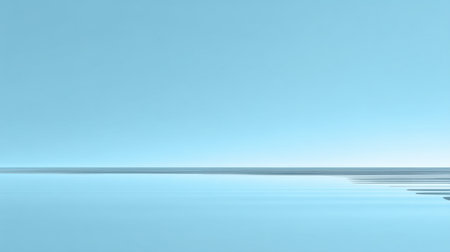 A vast blue horizon stretches over a calm water surface with subtle ripples. The clear sky creates a serene atmosphere, perfect for backgrounds and artworks.の素材