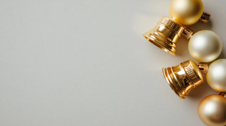 Discover a stunning arrangement of elegant golden bells and ornaments on a soft neutral background, ideal for holiday decorations, greeting cards, and creative projects.の素材