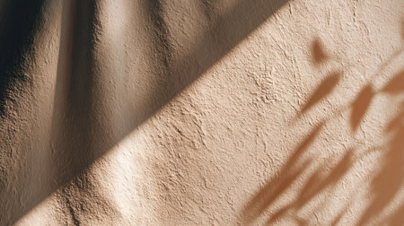This image captures a soft textured wall illuminated by gentle light, showcasing organic shadows today. Perfect for use in backgrounds and minimalist dの素材