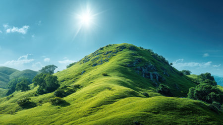 Experience the vibrant beauty of lush green hills bathed in bright sunlight, offering a tranquil and serene scene perfect for nature lovers and outdoor enthusiasts.の素材