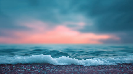 A peaceful seascape captures the soothing waves and vibrant sunset colors. The gentle foam meets the shore, creating a tranquil atmosphere for relaxation.の素材