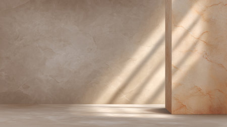This image captures a minimalist interior space with a textured beige wall and gentle light shadows, creating an elegant and serene atmosphere ideal for design projects.の素材