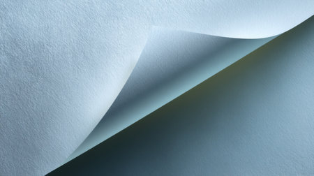 This image showcases soft blue textured paper with a curled edge, creating a gentle layered effect ideal for backgrounds, designs, and various creative projects.の素材