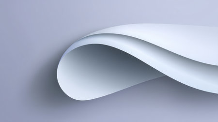 A delicate paper wave curls gracefully against a soft gray backdrop, creating a modern and minimalist aesthetic perfect for design and artistic projects.の素材