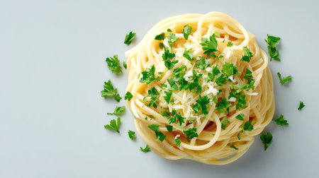 A stunning view of a plate of spaghetti topped with fresh parsley and grated cheese, perfect for showcasing culinary craftsmanship in food photography.の素材