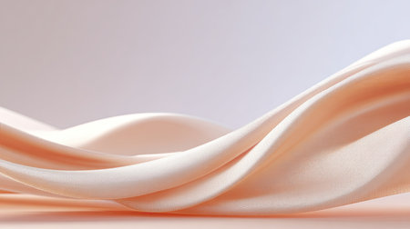 This image features a soft peach fabric elegantly draped to create gentle curves and a smooth texture, perfect for minimalist design themes and fashion applications.の素材