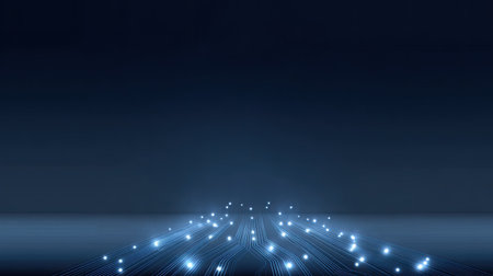 This abstract image showcases a dark blue background featuring bright light trails and glowing particles. It represents technology, innovation, and digitalization themes.の素材