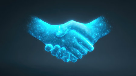 A digital representation of a handshake, symbolizing collaboration and unity. The glowing blue hands convey a sense of partnership in a modern tech-driven context.の素材