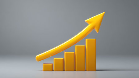 A vibrant yellow arrow rises above a series of yellow bars, illustrating the concept of growth and financial success against a neutral grey background. Ideal for business themes.の素材