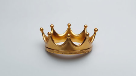 A luxurious gold crown resting on a light backdrop, perfect for themes of royalty, celebration, or fashion, symbolizing elegance and achievement in various contexts.の素材