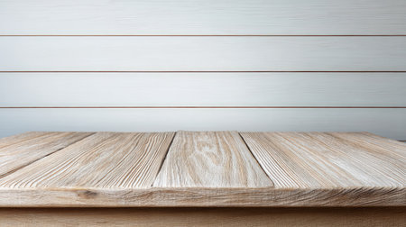 This image features an elegant wooden surface set against a light gray wooden plank background, creating an ideal backdrop for product displays or artistic photography.の素材