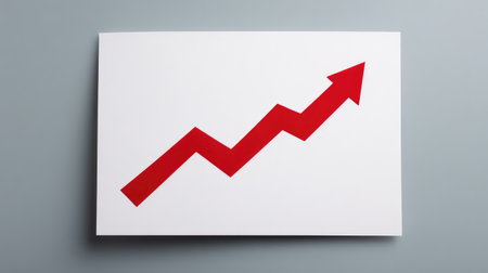 A striking red arrow on a white background symbolizes growth and progress in business, ideal for illustrating financial success, trends, and strategic development concepts.の素材