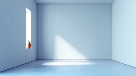 A serene and minimalist interior space featuring a single potted plant illuminated by natural light, creating a calm atmosphere perfect for relaxation or creative inspiration.の素材