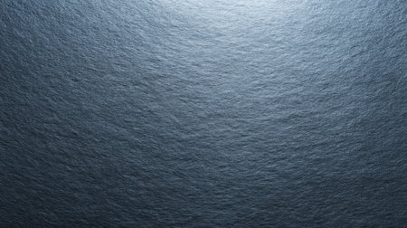 This image showcases a beautifully textured slate surface with gentle ripples and reflective light, perfect for enhancing modern designs and artistic projects.の素材