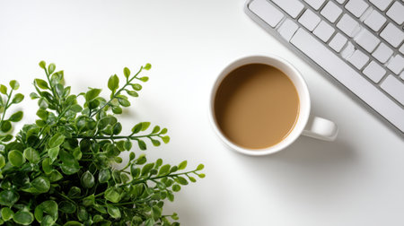 A serene workspace featuring a white desk with a coffee cup next to a lush green plant and a sleek keyboard, perfect for enhancing productivity and comfort.の素材