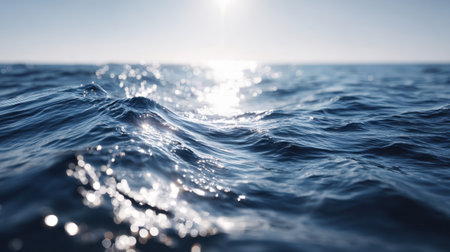 Explore the beauty of gentle ocean waves reflecting sunlight on a clear day. This serene seascape captures the tranquility and peace of nature's elements.の素材