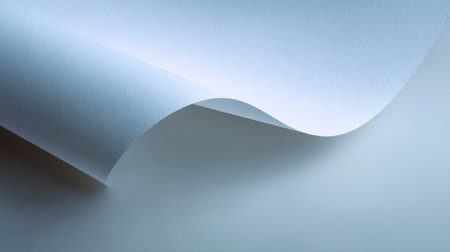 Showcase of a smooth white paper sheet gently curling on a soft light background, perfect for minimalistic design inspiration and various creative projects.の素材