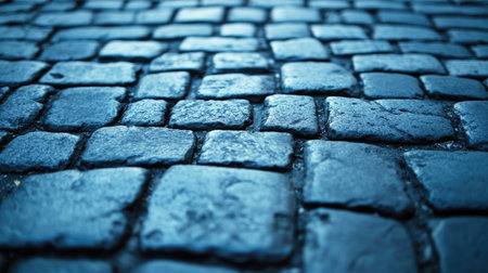 A close-up of cracked cement pavement with weathered edges, creating an urban, industrial background.の素材