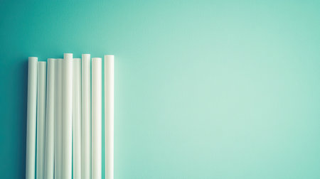 A set of biodegradable plant-based straws, arranged neatly on a clean surface.の素材