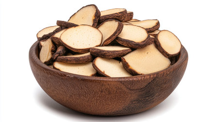 A small bowl of Japanese mushroom shiitake slices, isolated on white, showcasing their rich, earthy flavor perfect for winter brothsの素材