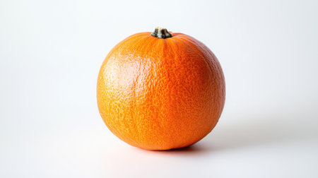 A bright orange pumpkin with a smooth texture on a white background, showcasing its round shape and vibrant colorの素材
