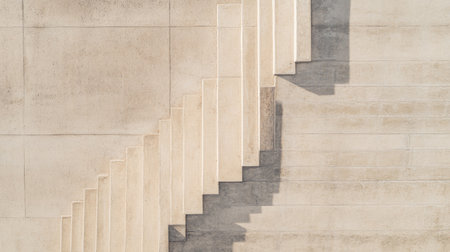 Aerial view of concrete stairs with sharp angles, showcasing geometric architectural elements.の素材