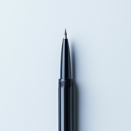 A sleek eyeliner pen with a sharp precision tip, makeup detail concept.の素材