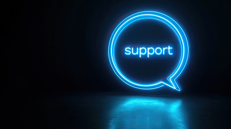 A neon blue chat support icon on a dark background, symbolizing real-time customer interactions.の素材