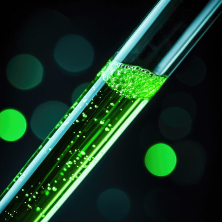 A test tube with a bubbling green liquid, science experiment concept.の素材