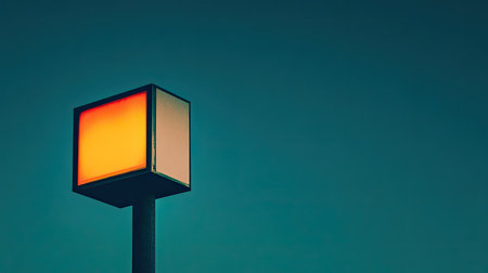 Brightly lit business sign on a minimalist building, standing out against the night.の素材