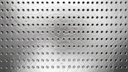 Textured silver background with a perforated pattern, creating a modern and industrial aesthetic.の素材