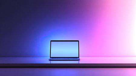 A sleek laptop on a modern white desk, illuminated by soft ambient lighting, with a minimalist background.の素材