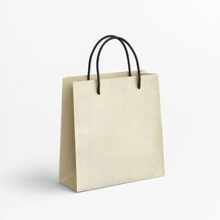 Minimalist canvas shopping bag with a blank surface, ideal for branding mockups and eco-friendly lifestyle themes, on a white background.の素材