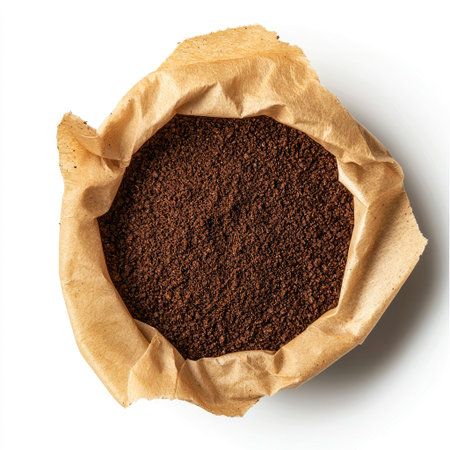 A clean coffee filter with coffee grounds inside, isolated on a white background, emphasizing textureの素材