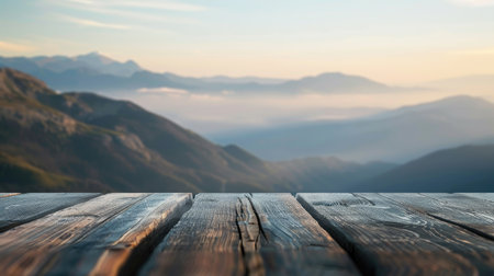 Decorative space on table, backdrop of distant mountains softly blurredの素材