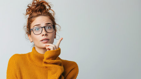 Determined woman making a 'call me' gestureの素材