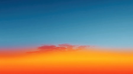 A breathtaking sunset scene showcasing a vibrant sky with a smooth gradient of orange and blue hues. Gentle clouds enhance the beauty of nature at dusk.の素材