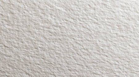 A closeup view of a textured paper surface displays natural fibers and a soft muted tone. Ideal for backgrounds in creative design projects and artistic applications.の素材