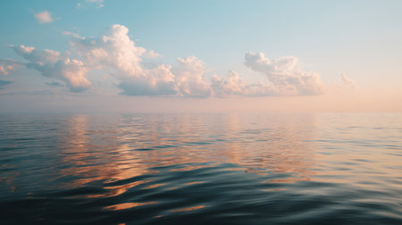 This mesmerizing image captures the beauty of a calm ocean at dusk, with soft clouds and gentle waves reflecting a colorful sky, evoking peace and tranquility.の素材