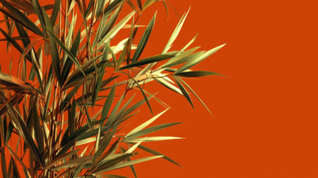 This image features lush bamboo leaves against a vibrant orange background, combining natural beauty with a modern aesthetic. Perfect for decor and design inspiration.の素材