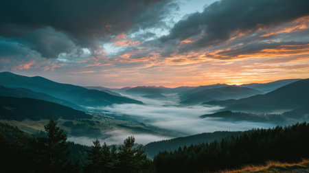 Witness a breathtaking view of a serene valley at sunrise, where rolling hills meet misty landscapes under a dramatic sky, evoking tranquility and beauty.の素材