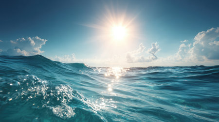 Captivating view of gentle ocean waves under a bright sun, creating a peaceful and serene atmosphere perfect for relaxation and scenic beach escapes.の素材