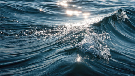 A serene close-up of gentle ocean waves reflecting sunlight, showcasing the beauty of water movement. This image evokes feelings of calm and peacefulness in nature.の素材