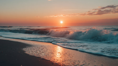 Experience a picturesque sunset over gentle ocean waves, where warm colors blend beautifully in the sky. This serene beach scene invites relaxation and peace.の素材