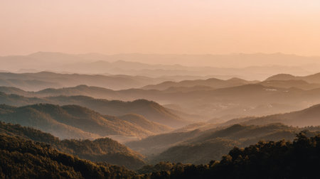 A stunning mountain landscape showcasing layered hills under soft morning light, ideal for those seeking tranquility in nature and breathtaking outdoor views.の素材