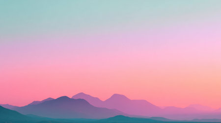 A breathtaking view of mountains under a soft pastel sky at dawn. The gentle hues of pink, purple, and blue create a serene and tranquil atmosphere in nature.の素材