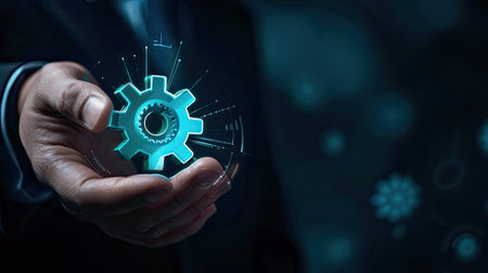 Virtual gear icon in businessman's hand, business automation and productivityの素材